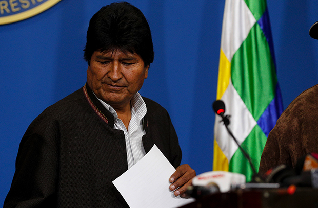 Bolivia's President Evo Morales looks down during a press conference in La Paz, Bolivia, Sunday, Nov. 10, 2019. Morales is calling for new presidential elections and an overhaul of the electoral system Sunday after a preliminary report by the Organization of American States found irregularities in the Oct. 20 elections. (AP Photo/Juan Karita)